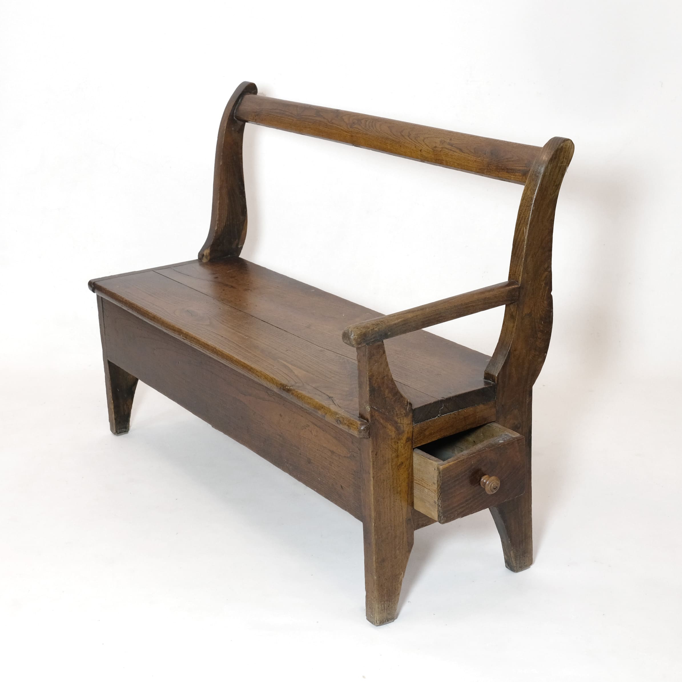 Handcrafted wooden bench with armrest and drawer on the left.