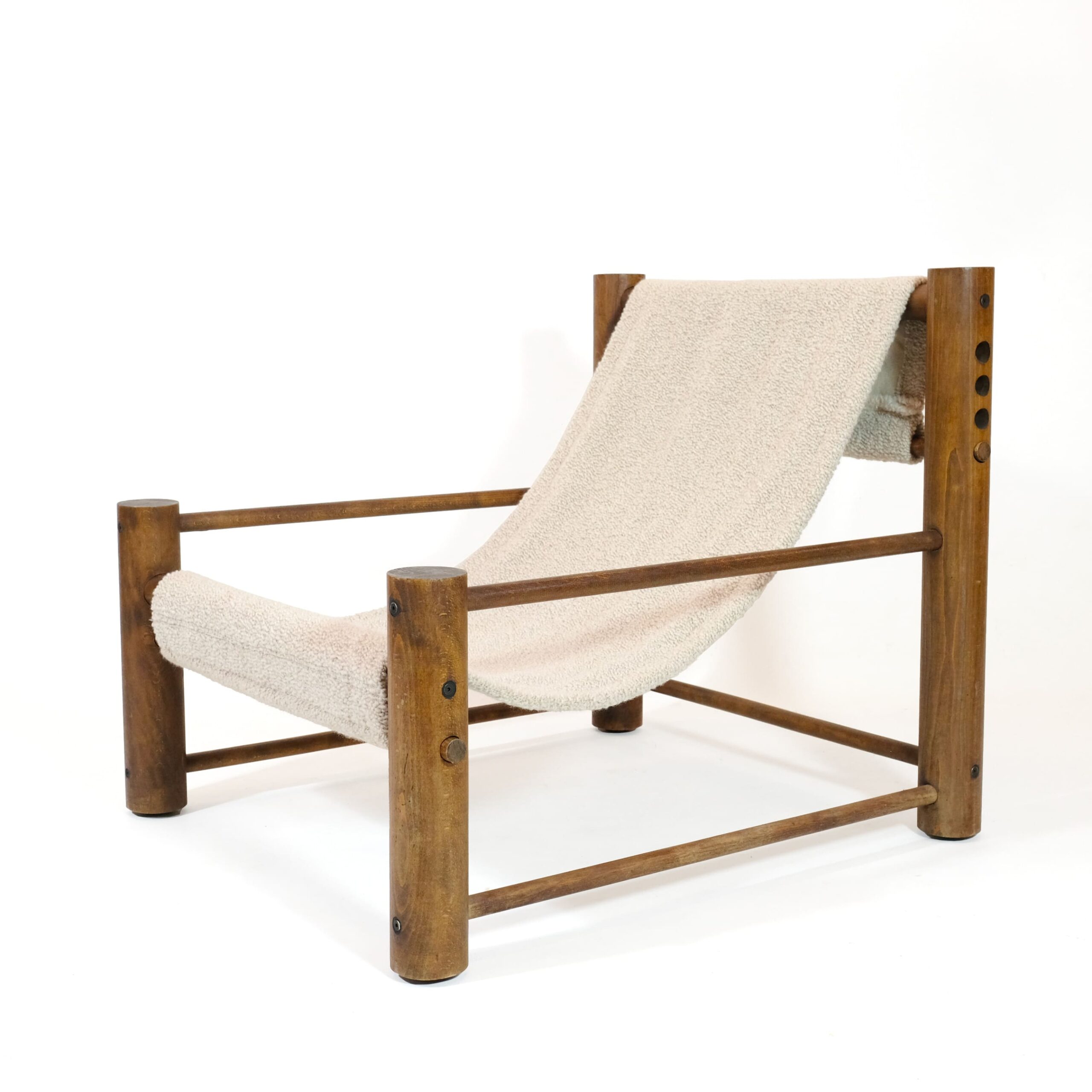 Solid wood lounge chair with an adjustable seat.