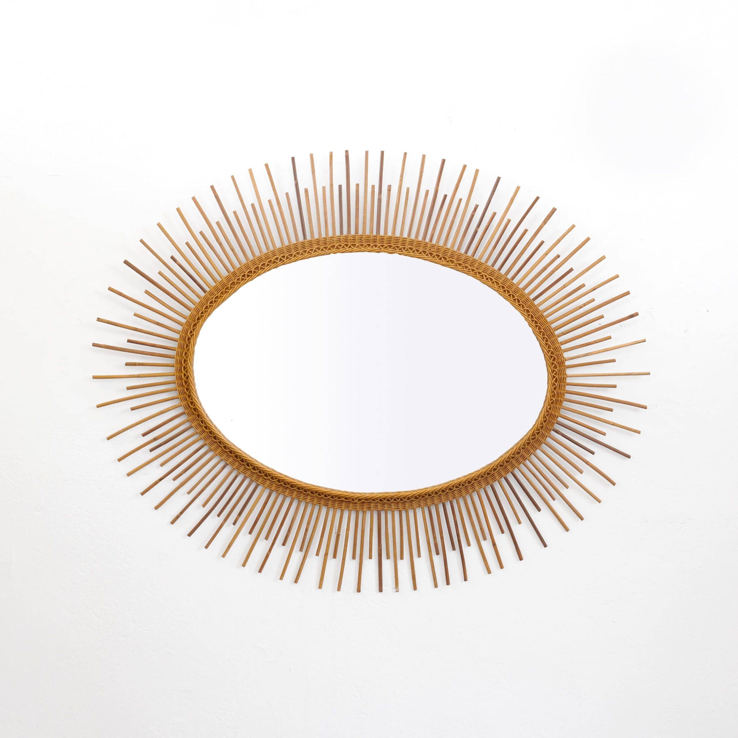 Large rattan sun shaped mirror, 100x80cm.